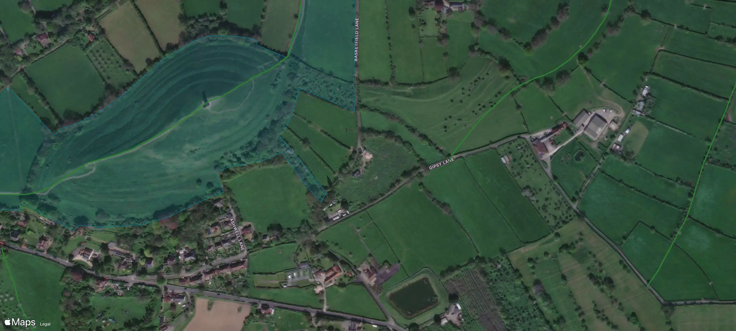 Satellite view of Glastonbury Tor, with the National Trust land shaded and the public footpaths drawn in green